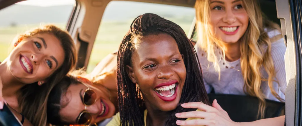 car full of adults talk about what causes crowded teeth