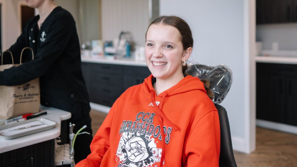 teen athlete wearing sports mouthguard for braces