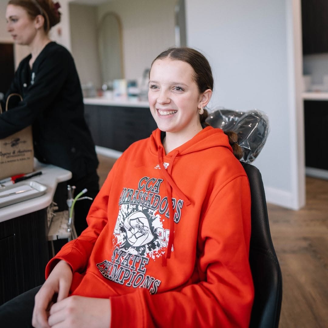 A happy teen patient in the treatment chair